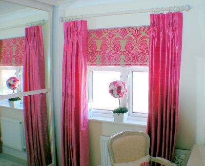 Interior Workshop - Pleated curtains hung under a white pole.